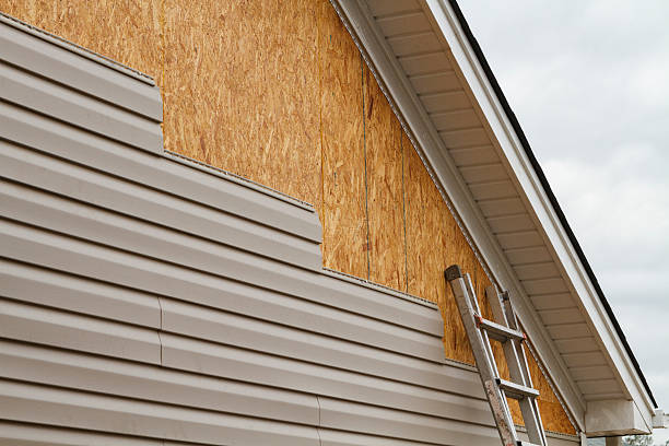Professional Vinyl Siding technician working in Fairview, NY